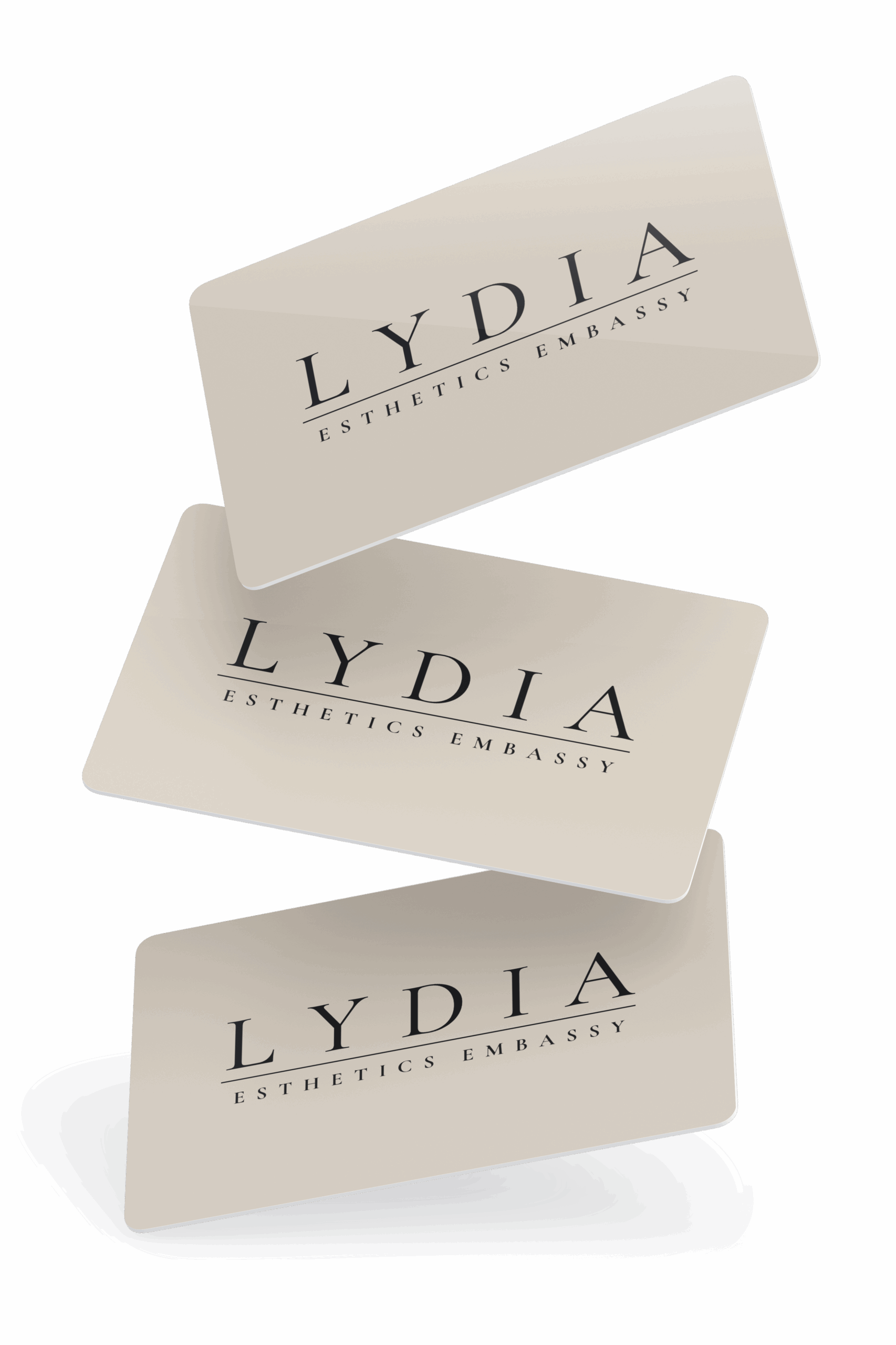 Lydia Esthetics Embassy Three beige business cards with rounded corners, each displaying "LYDIA ESTHETICS EMBASSY" in black capital letters, arranged in a floating, staggered layout—reflecting the refined style of Esthetics Embassy New York. New York