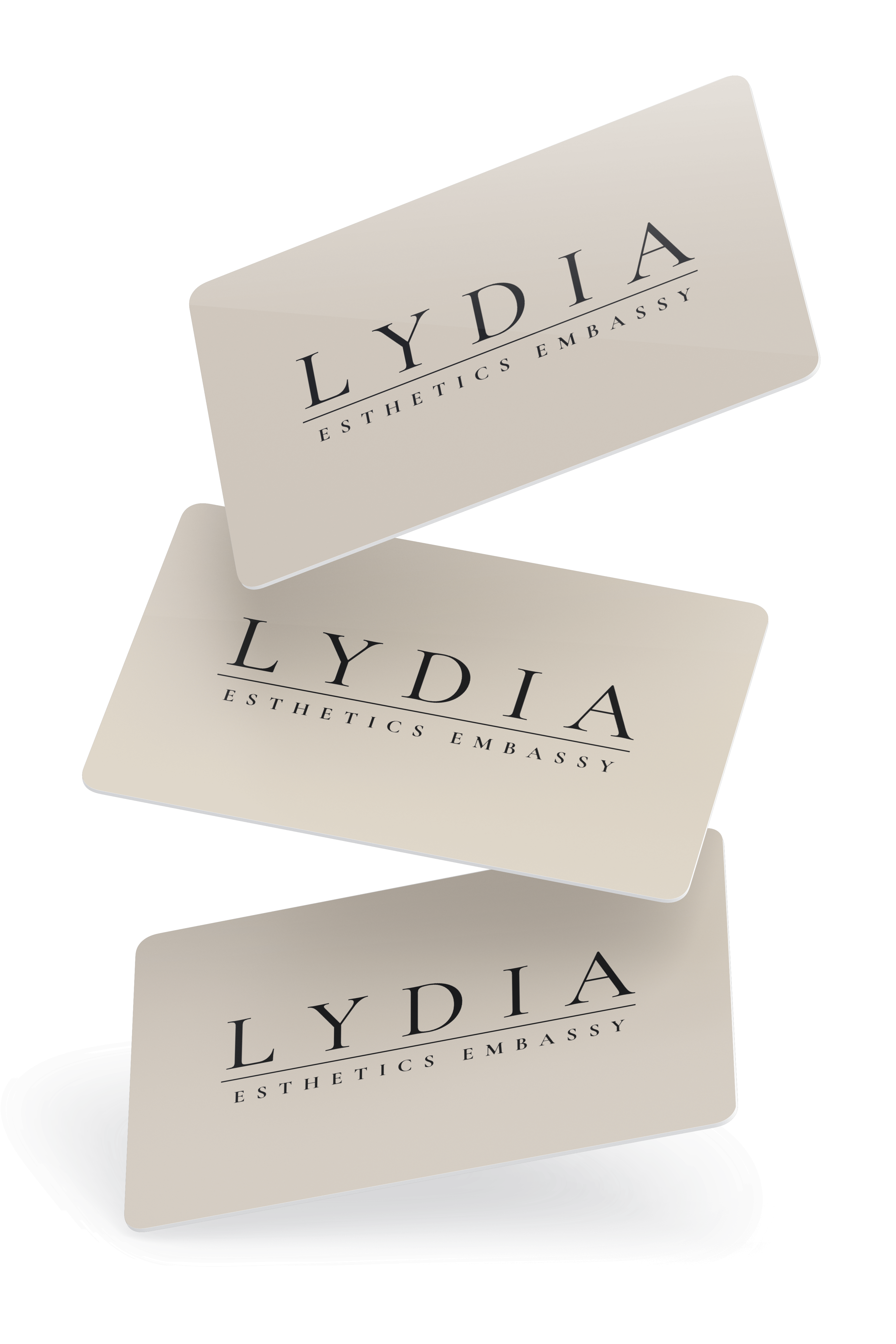 Lydia Esthetics Embassy Three beige business cards with rounded corners, each displaying "LYDIA ESTHETICS EMBASSY" in black capital letters, arranged in a floating, staggered layout—reflecting the refined style of Esthetics Embassy New York. New York