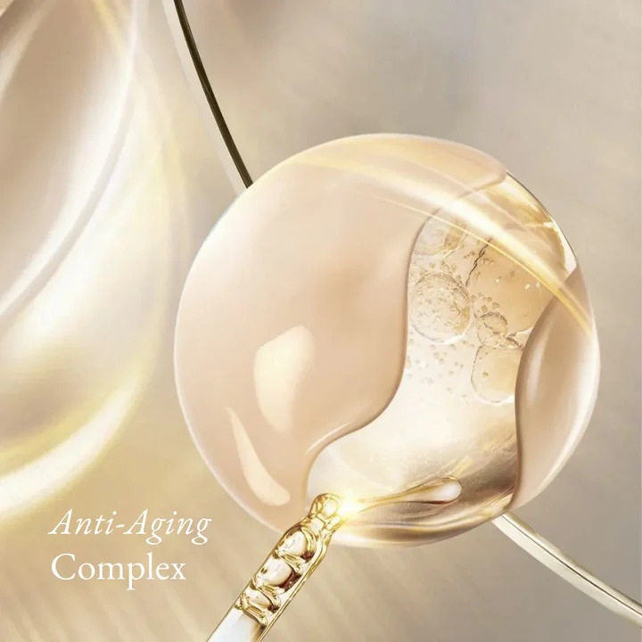 Lydia Esthetics Embassy Close-up of a dropper with cream and clear serum, highlighting bubbles inside the liquid. The text “Anti-Aging Complex” appears in the lower left corner. New York